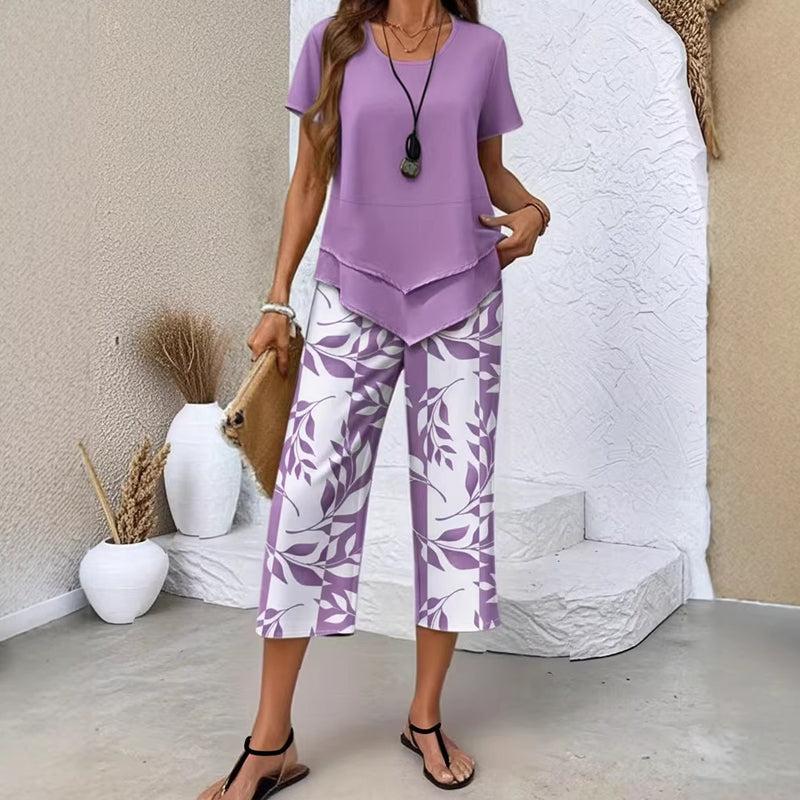 🎉53% Rabatt – Nur für kurze Zeit!✨ Modisches 2-in-1-Set | Oberteil mit asymmetrischem Saum + bedruckte Hose | S–5XL 👗