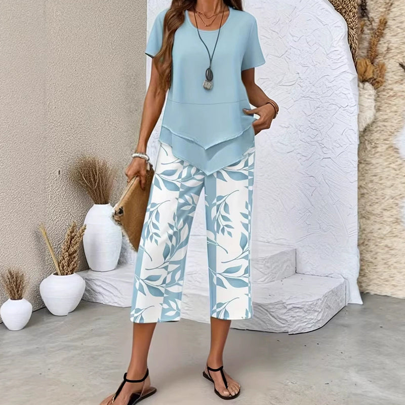 🎉53% Rabatt – Nur für kurze Zeit!✨ Modisches 2-in-1-Set | Oberteil mit asymmetrischem Saum + bedruckte Hose | S–5XL 👗
